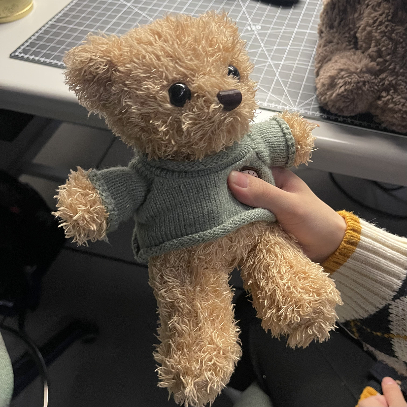 Mario was mainly being held in the stomach area. Users liked his shirt. When he was being held, he was facing the user. This implies to put a sensor near his chest or hip area.